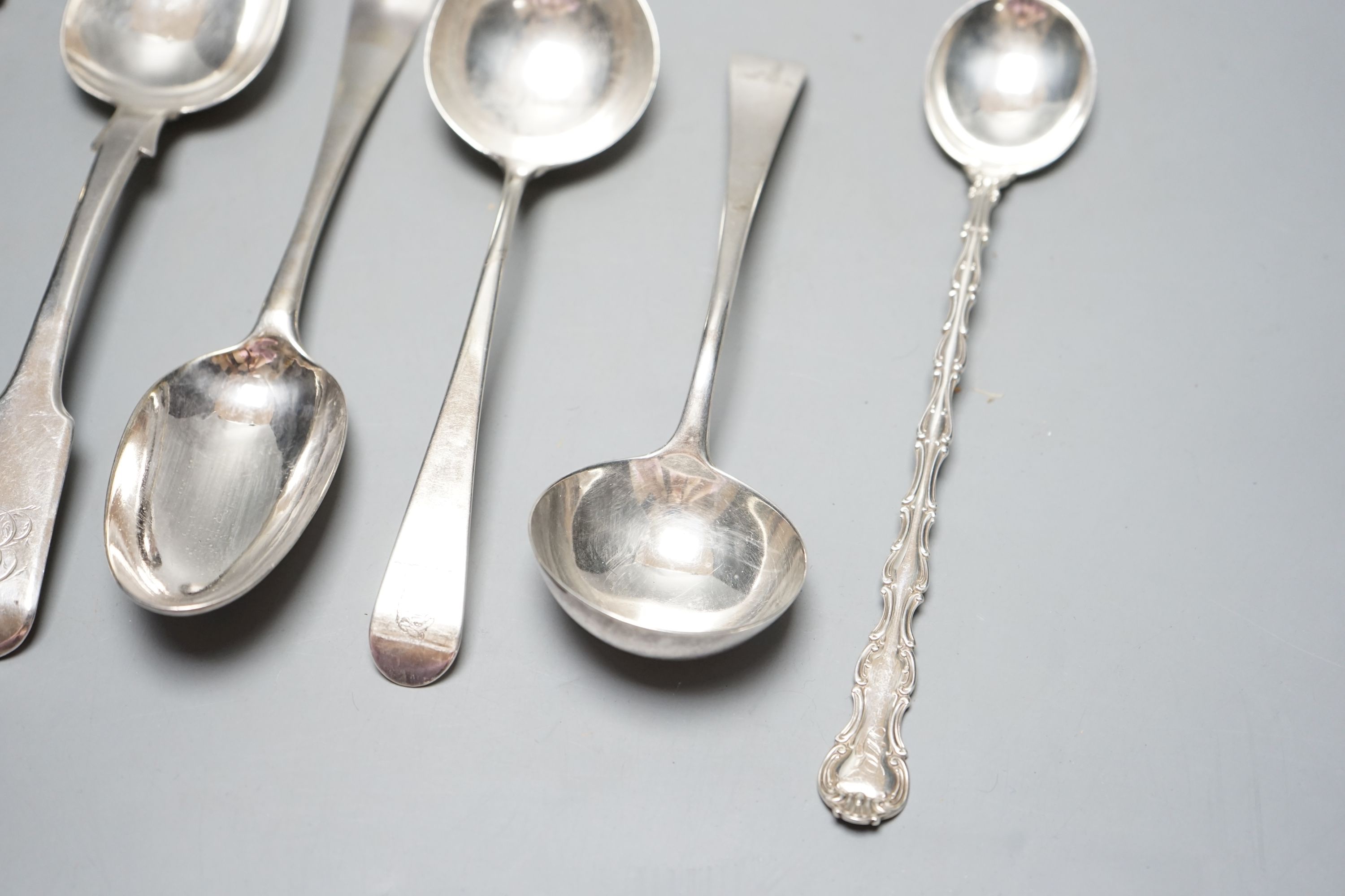 A pair of George III silver Old English pattern sauce ladles, London, 1782, 18cm, a pair of Victorian silver gilt apostle spoons, London, 1877, two Georgian silver spoons, London, 1744 & Exeter, 1818 and a sterling spoon